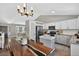 Bright kitchen and dining area with stainless steel appliances and wood-look table at 5323 E Hamilton Ave, Castle Rock, CO 80104