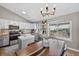 Bright eat-in kitchen featuring white cabinets, stainless steel appliances, and butcher block counters at 5323 E Hamilton Ave, Castle Rock, CO 80104