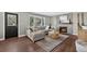 Inviting living room with a fireplace, modern decor, and hardwood flooring at 5323 E Hamilton Ave, Castle Rock, CO 80104