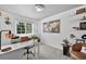 Bright home office with large window, desk, and shelves for storage at 5323 E Hamilton Ave, Castle Rock, CO 80104