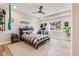 Bedroom featuring large windows, an edgy fan, and decor at 6242 W Lakeside Ct, Littleton, CO 80125