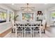 Cozy dining room with stylish furnishings, a modern light fixture, and ample natural light at 6242 W Lakeside Ct, Littleton, CO 80125