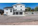 Spacious two-car garage with a paved driveway and landscaped surroundings, providing convenient parking and curb appeal at 6242 W Lakeside Ct, Littleton, CO 80125