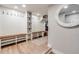 Mudroom featuring hooks, seating and storage at 6242 W Lakeside Ct, Littleton, CO 80125