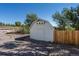 Exterior view of a well-maintained shed with a simple design, surrounded by trees and landscaping at 6242 W Lakeside Ct, Littleton, CO 80125