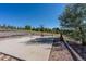 Outdoor sport court featuring a basketball hoop and net, perfect for recreational activities and enjoying the outdoors at 6242 W Lakeside Ct, Littleton, CO 80125