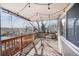 Cozy outdoor back deck with string lights and scenic neighborhood views at 9443 Palisade Ct, Highlands Ranch, CO 80130