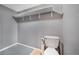 Functional half bathroom features built in shelving for plenty of storage at 9443 Palisade Ct, Highlands Ranch, CO 80130