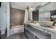 Modern bathroom with a double vanity and updated shower at 9443 Palisade Ct, Highlands Ranch, CO 80130