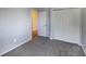 Bedroom featuring a carpeted floor, chair railing and a closet with sliding doors at 9443 Palisade Ct, Highlands Ranch, CO 80130