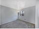 Bright bedroom with gray carpet, base trim and a view overlooking a backyard at 9443 Palisade Ct, Highlands Ranch, CO 80130