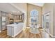 Open dining area with vaulted ceilings, hardwood floors, and access to the kitchen and sliding glass door at 9443 Palisade Ct, Highlands Ranch, CO 80130