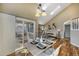 Dining area featuring hardwood floors, access to the deck, kitchen, and living room at 9443 Palisade Ct, Highlands Ranch, CO 80130