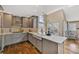 Charming kitchen with updated appliances, custom cabinets, and a farmhouse sink at 9443 Palisade Ct, Highlands Ranch, CO 80130