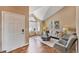 Open-concept living room with beautiful hardwood floors and large window, perfect for entertaining at 9443 Palisade Ct, Highlands Ranch, CO 80130