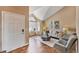 Inviting living room with high vaulted ceilings, hardwood floors, and modern décor at 9443 Palisade Ct, Highlands Ranch, CO 80130