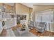 Bright living room with staircase and an adjacent kitchen offers comfortable living at 9443 Palisade Ct, Highlands Ranch, CO 80130