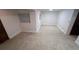 A spacious basement with neutral carpet, bright walls, and a window for natural light at 14282 E Radcliff Cir, Aurora, CO 80015