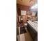 Full bathroom with patterned wallpaper at 14282 E Radcliff Cir, Aurora, CO 80015