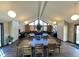 The clubhouse boasts a large table, seating and plenty of natural light from the grand windows at 14282 E Radcliff Cir, Aurora, CO 80015