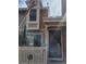 Charming two-story home with a welcoming entrance and manicured front yard at 14282 E Radcliff Cir, Aurora, CO 80015