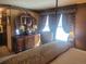 Bedroom with a large dresser, vanity mirror, and a bright window at 14282 E Radcliff Cir, Aurora, CO 80015