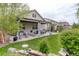 Beautiful backyard boasts mature landscaping, multiple seating areas, and a patio, ideal for relaxing and entertaining at 4767 S Odessa St, Centennial, CO 80015