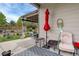 Backyard patio featuring outdoor seating, an umbrella, and a view of the landscaped yard at 4767 S Odessa St, Centennial, CO 80015