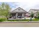 The backyard features a covered patio, lush lawn, and mature trees, perfect for outdoor enjoyment and relaxation at 4767 S Odessa St, Centennial, CO 80015