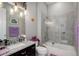 Modern bathroom featuring granite counters, a tub-shower combo, and stylish fixtures creating a spa-like experience at 4767 S Odessa St, Centennial, CO 80015