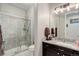 Bathroom featuring a shower and dark wood vanity with granite counter at 4767 S Odessa St, Centennial, CO 80015
