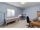 Bedroom with neutral paint, large window and home office furniture at 4767 S Odessa St, Centennial, CO 80015
