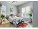 Cozy bedroom filled with natural light, ceiling fan, plantation shutters, and charming decor at 4767 S Odessa St, Centennial, CO 80015