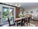 An inviting dining area with sliding glass doors, a sliding barn door, and views to the backyard at 4767 S Odessa St, Centennial, CO 80015