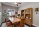 Elegant dining area with hardwood floors, large table, and stylish china cabinet for a complete entertaining space at 4767 S Odessa St, Centennial, CO 80015