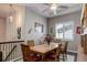 Inviting dining room featuring a ceiling fan, natural light, and a spacious table to host gatherings at 4767 S Odessa St, Centennial, CO 80015