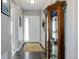 Welcoming entryway with hardwood floors, decorative rug, and glass display case adding a touch of elegance at 4767 S Odessa St, Centennial, CO 80015