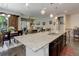 Modern kitchen features a large granite island that overlooks an open-concept living and dining area at 4767 S Odessa St, Centennial, CO 80015