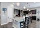 Kitchen island with granite countertops and modern dark wood cabinetry at 4767 S Odessa St, Centennial, CO 80015