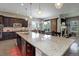 Open kitchen with a large island and hardwood floors, lots of room for seating at 4767 S Odessa St, Centennial, CO 80015