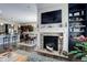 Open-concept living room with fireplace and access to dining area and kitchen at 4767 S Odessa St, Centennial, CO 80015