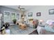 Bright living room featuring hardwood floors, neutral colors, and multiple windows at 4767 S Odessa St, Centennial, CO 80015
