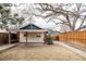 The backyard features a spacious patio, a grassy area, and a wooden fence at 2355 Forest St, Denver, CO 80207