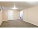 Unfinished basement with neutral carpet offers a versatile space for your needs at 2355 Forest St, Denver, CO 80207