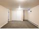 Finished basement with neutral carpet, baseboard heating and closet at 2355 Forest St, Denver, CO 80207