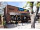 A street view of the brick building with a sign that reads Lucina Eatery & Bar at 2355 Forest St, Denver, CO 80207