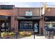 Street view of a brick building with a Scoops ice cream sign and an awning at 2355 Forest St, Denver, CO 80207