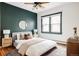 This bedroom boasts natural light, and is elegantly furnished with lamps and woven night stands at 2355 Forest St, Denver, CO 80207