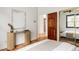 This bedroom is elegantly designed and well lit with decorative side table with flowers at 2355 Forest St, Denver, CO 80207
