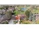 Breathtaking aerial view of the home overlooking a lush golf course and serene water features at 4749 Old Post Ct, Boulder, CO 80301